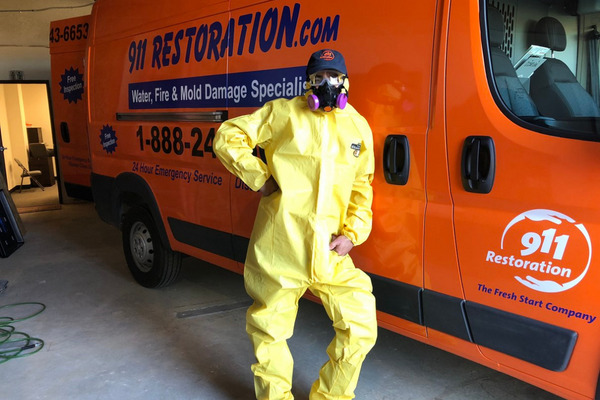 911 restoration worker with Hazmat suit